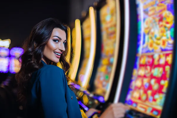 A close-up shot of golden coins falling around a spinning roulette wheel, representing immersive casino action at ZBZBET.