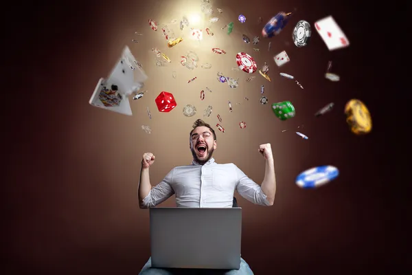 A woman smiling while playing online games on her laptop, surrounded by neon casino elements, showcasing ZBZBET’s diverse game collection.