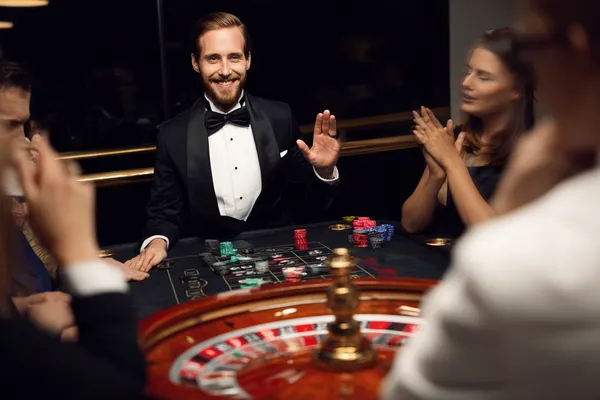 A confident dealer surrounded by casino chips inviting players to access their ZBZBET account, reflecting quick and easy login options.